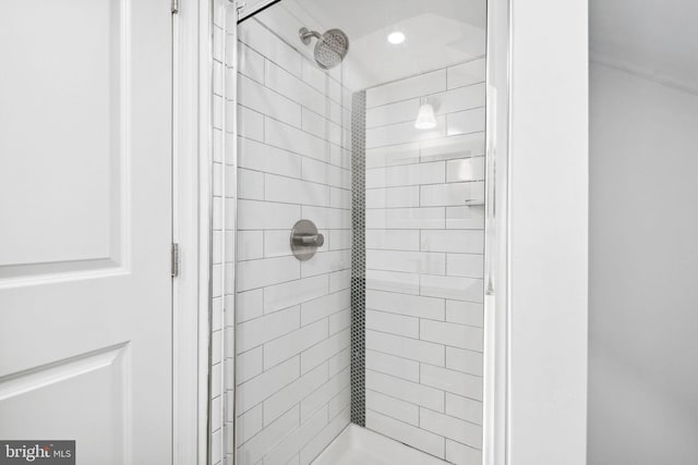 bathroom with tiled shower