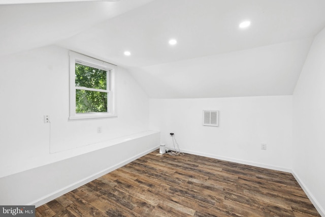 bonus room featuring vaulted ceiling and dark hardwood / wood-style floors