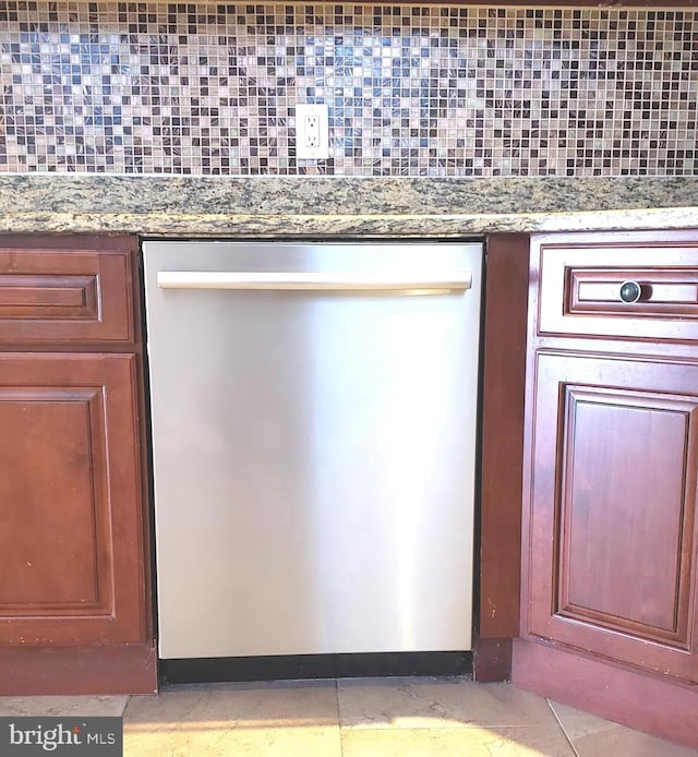 interior details with decorative backsplash, stainless steel dishwasher, and stone counters