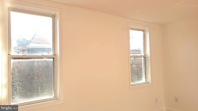 spare room featuring a wealth of natural light