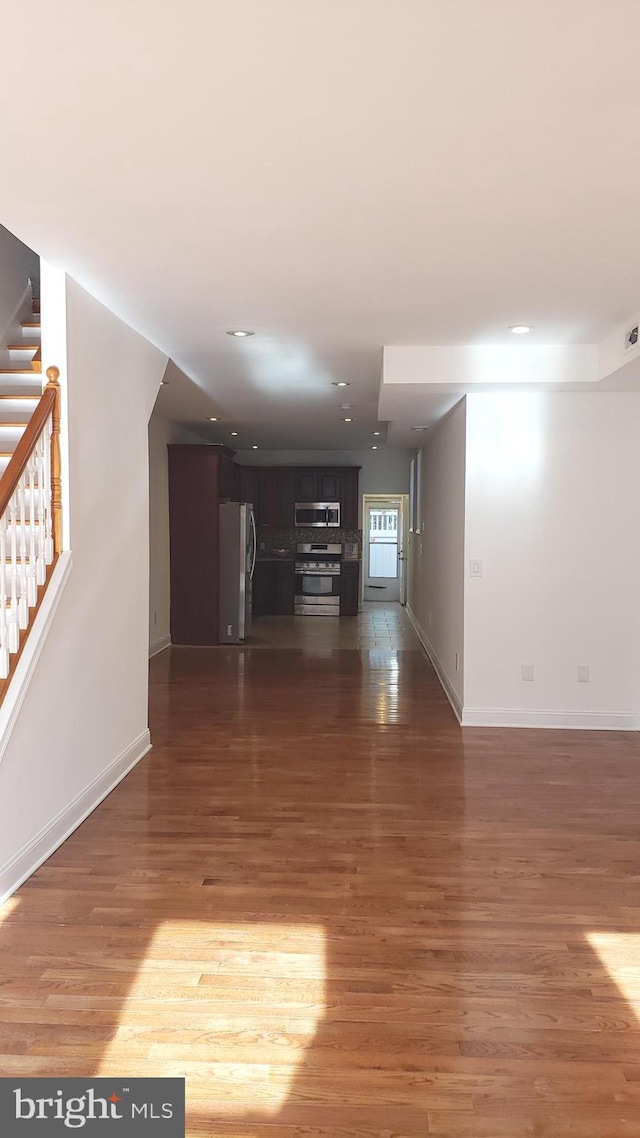 empty room featuring dark wood-type flooring