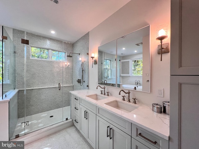 bathroom featuring vanity, tile patterned floors, and a shower with shower door