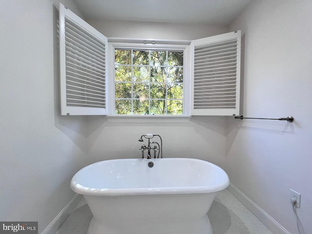 bathroom with a tub