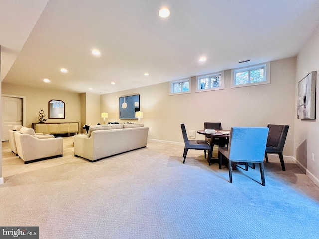 living room featuring light carpet