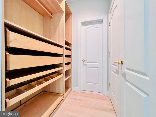 spacious closet featuring hardwood / wood-style flooring