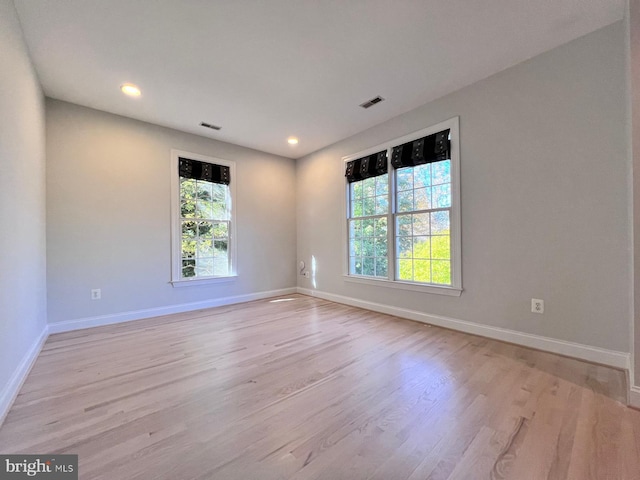 unfurnished room featuring light wood-type flooring