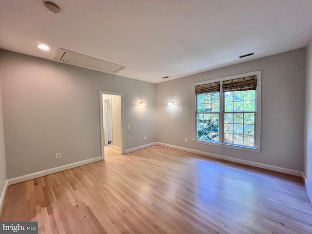 spare room featuring light hardwood / wood-style floors