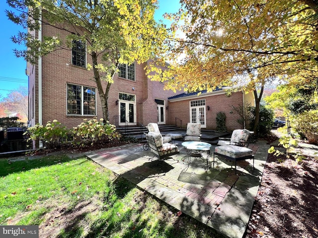 back of house with french doors and a patio