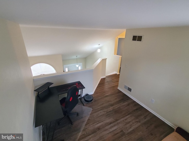 home office with dark hardwood / wood-style flooring