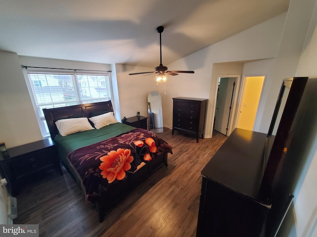 bedroom with ceiling fan, vaulted ceiling, and hardwood / wood-style flooring