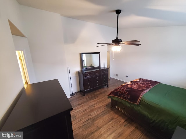 bedroom featuring dark hardwood / wood-style flooring and ceiling fan