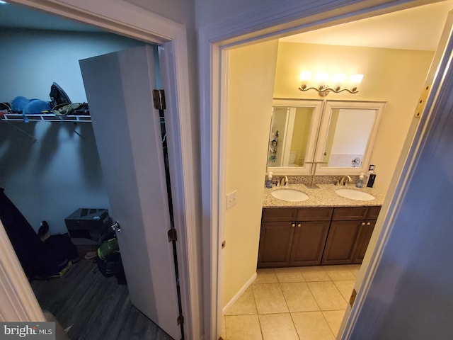 bathroom featuring tile patterned floors and vanity