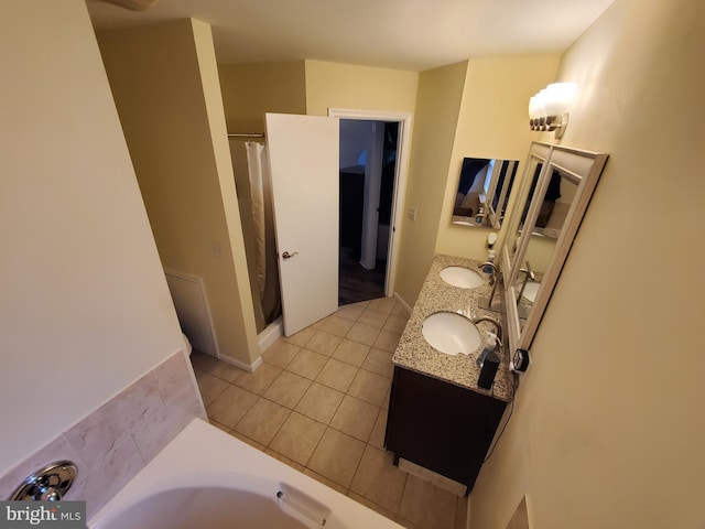 bathroom with tile patterned flooring, vanity, and independent shower and bath