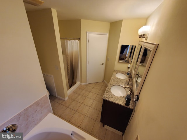 bathroom with tile patterned flooring, vanity, and independent shower and bath