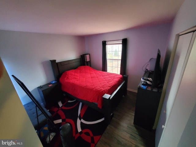 bedroom featuring dark hardwood / wood-style flooring