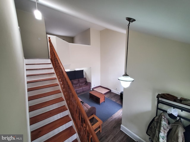 stairs featuring hardwood / wood-style flooring