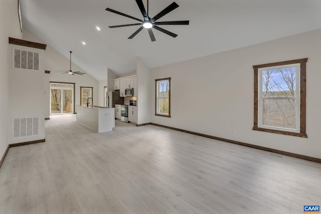 unfurnished living room featuring ceiling fan, light hardwood / wood-style flooring, and high vaulted ceiling