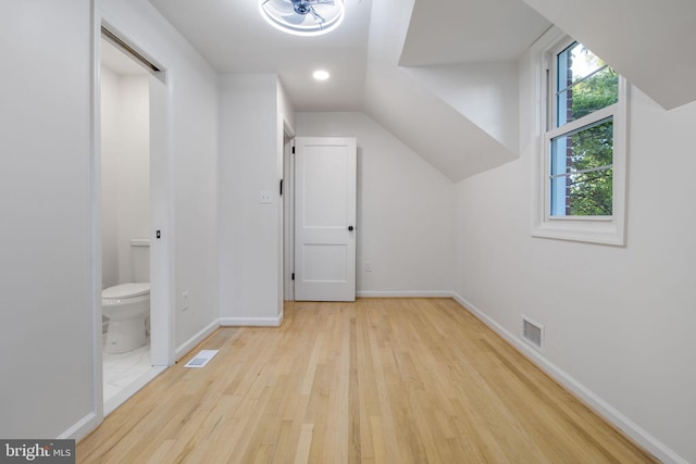 additional living space featuring light hardwood / wood-style floors