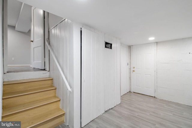 staircase featuring hardwood / wood-style flooring