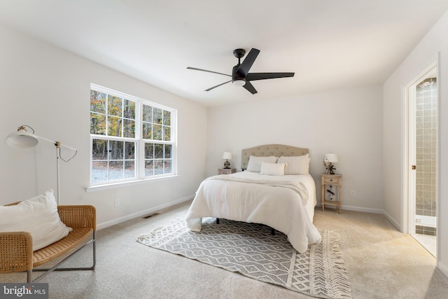 carpeted bedroom with visible vents, baseboards, and ceiling fan