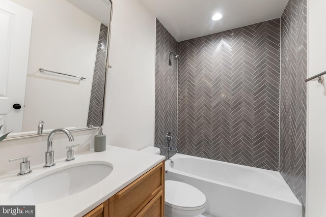 bathroom with recessed lighting, shower / bathtub combination, vanity, and toilet