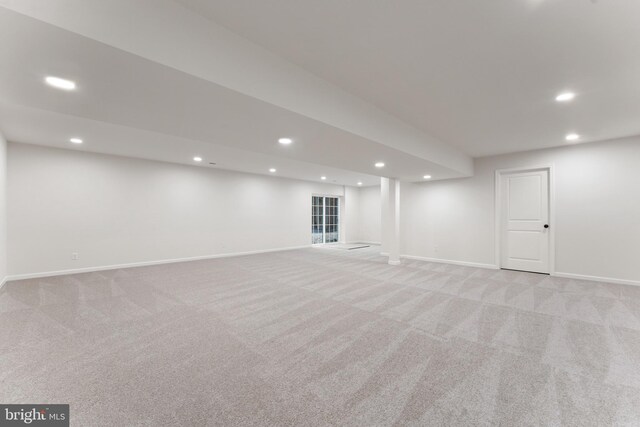 finished basement featuring baseboards and recessed lighting