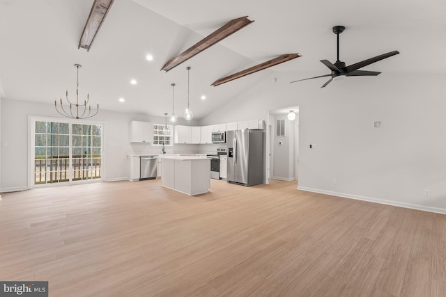 unfurnished living room featuring beam ceiling, ceiling fan with notable chandelier, light hardwood / wood-style floors, and high vaulted ceiling