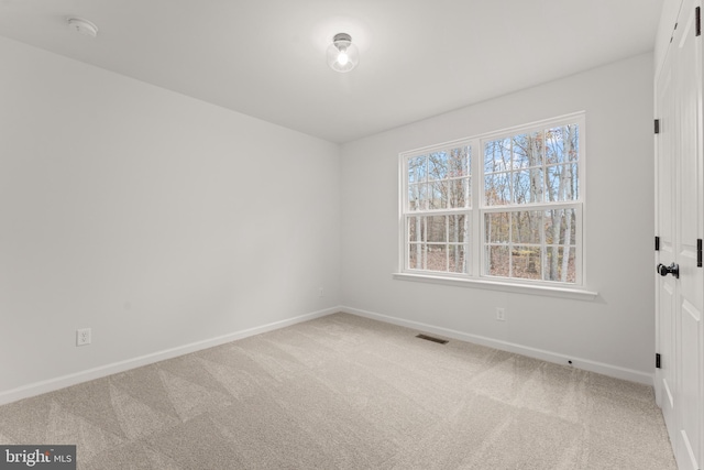 empty room featuring carpet flooring