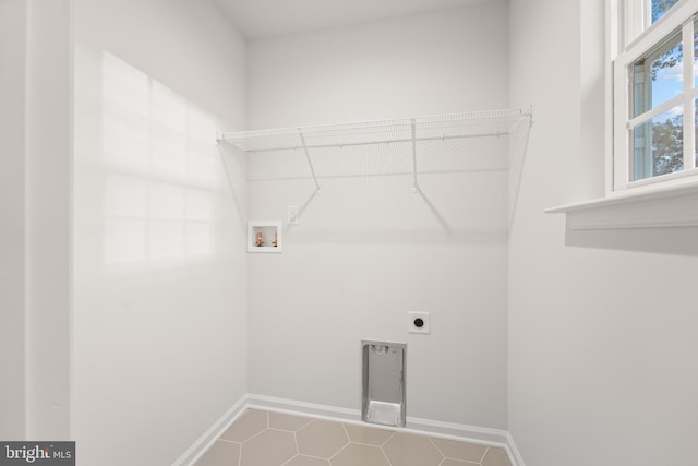 clothes washing area with hookup for a washing machine and electric dryer hookup