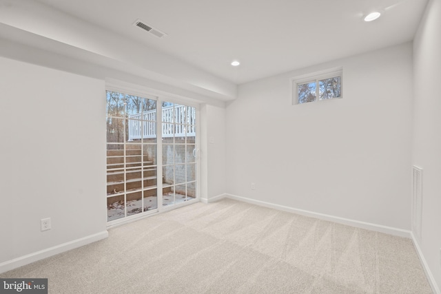 empty room with light colored carpet