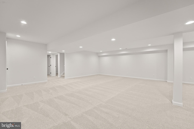 basement with light colored carpet