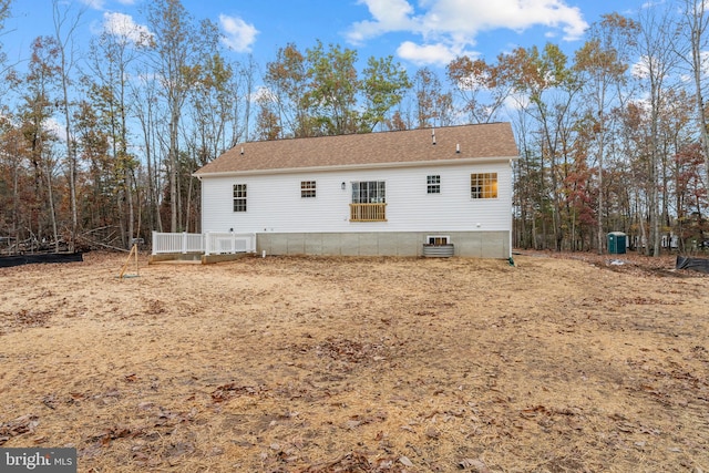 rear view of property featuring cooling unit