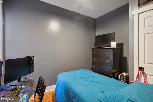 bedroom featuring ceiling fan and light hardwood / wood-style flooring