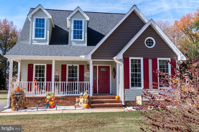 view of front of home featuring a front yard and a porch