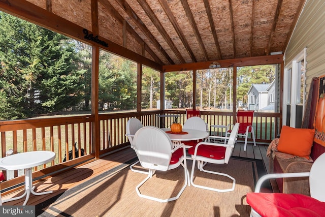 sunroom / solarium with vaulted ceiling