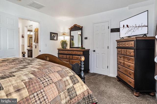 carpeted bedroom featuring ensuite bathroom