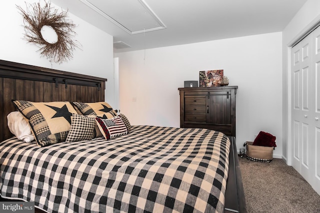 bedroom with carpet and a closet