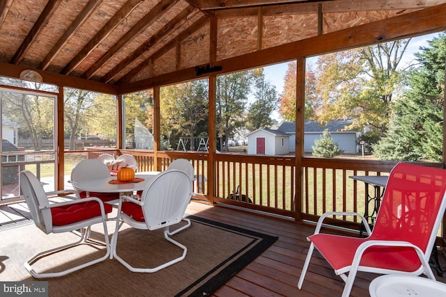 sunroom with lofted ceiling with beams