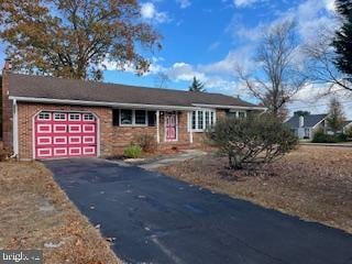 ranch-style home with a garage