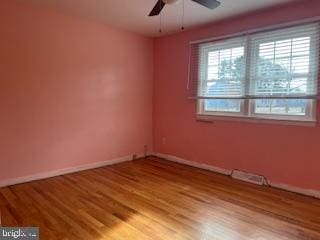 unfurnished room featuring light hardwood / wood-style floors and ceiling fan