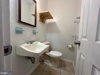 bathroom featuring tile patterned floors and toilet