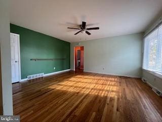 unfurnished bedroom with ceiling fan and wood-type flooring