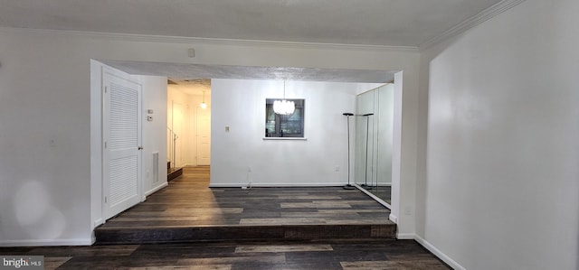 corridor featuring ornamental molding and dark wood-type flooring