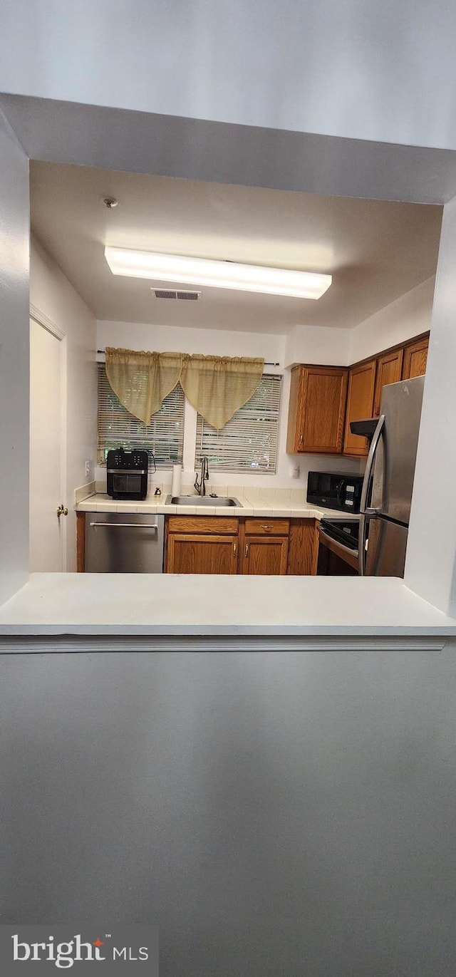 kitchen with sink and stainless steel appliances