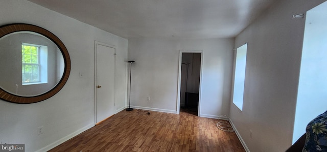 unfurnished room featuring hardwood / wood-style floors