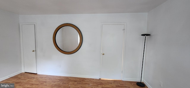 spare room with light wood-type flooring