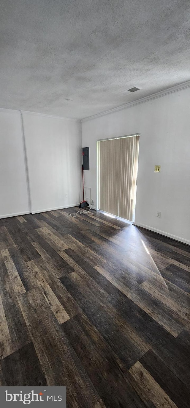 unfurnished room featuring a textured ceiling and dark wood-type flooring