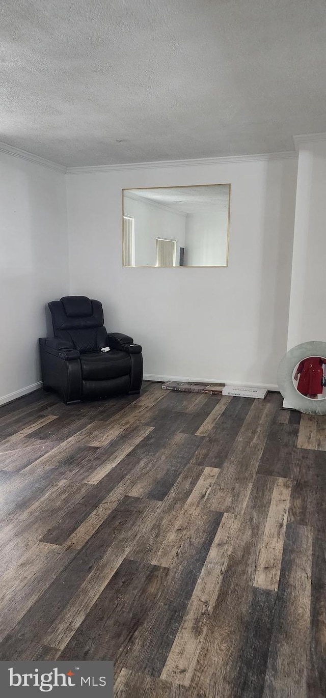 living area featuring a textured ceiling and dark wood-type flooring