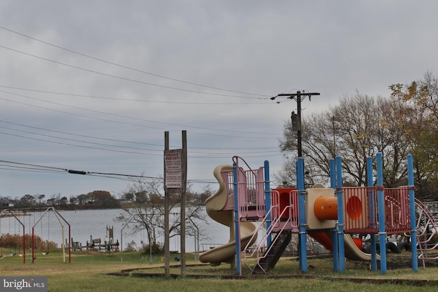 view of jungle gym featuring a water view