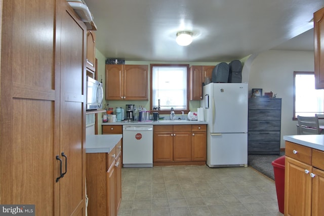 kitchen featuring sink and white appliances